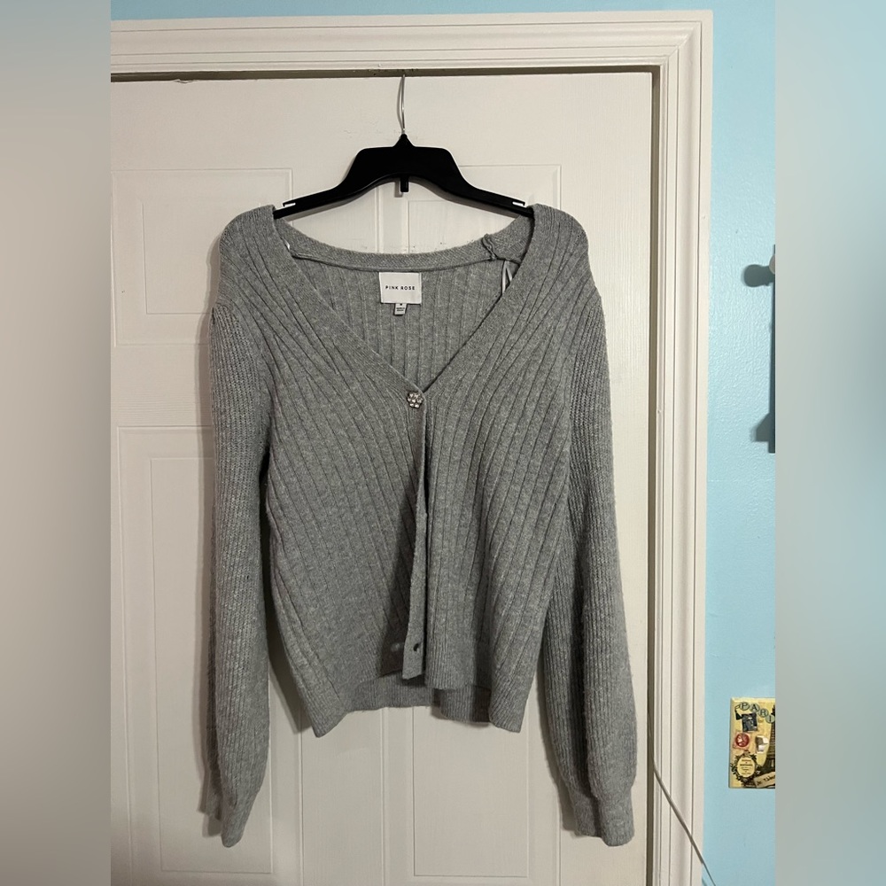 a soft, grey, button down cardigan